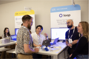 Attendees chatting at CommerceNext